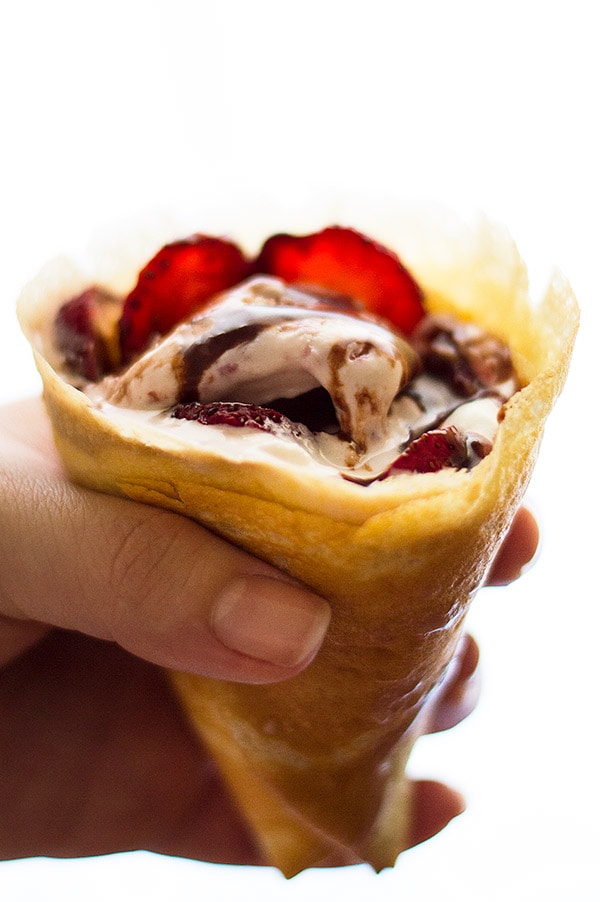 Put leftover crepes to good use and turn them into crepe cones! Perfect for a sunny summer day, these cones are stuffed with strawberry ice cream, fresh strawberries, and whipped cream, and drizzled with a quick and easy Nutella sauce. Recipe includes nutritional information. From BakingMischief.com