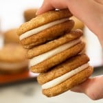 Rich and delicious eggnog buttercream frosting snuggled inside of Snickerdoodle Sandwich Cookies makes for a perfect holiday treat! Recipe includes nutritional information. From BakingMischief.com