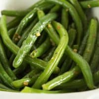No-fail Butter and Garlic Green Beans - Perfectly cooked green beans tossed with butter and toasted garlic. A quick, easy, and delicious vegetable side dish. From BakingMischief.com