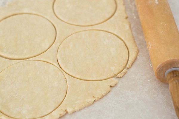 Buttermilk pie dough being cut into rounds.