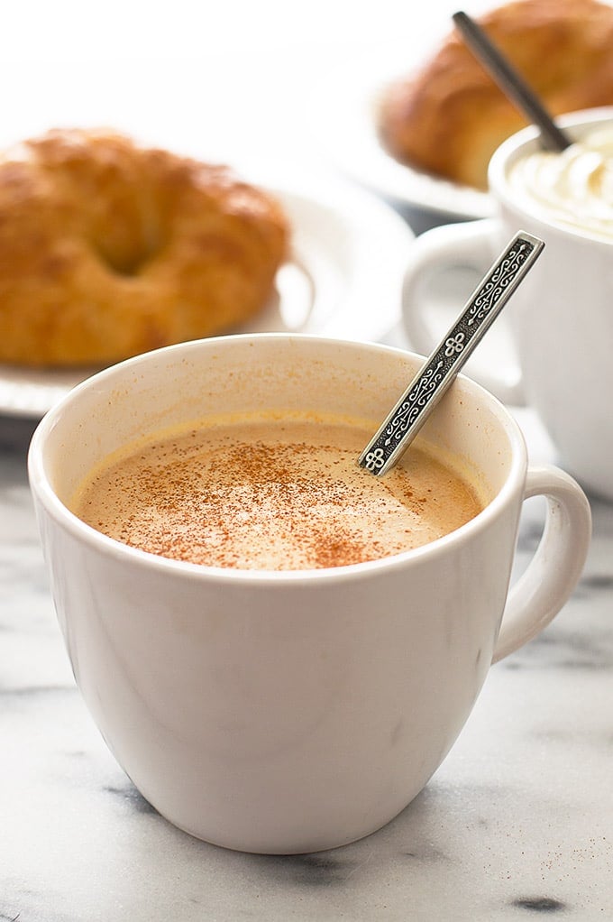 Light Pumpkin spice latte on a marble table.