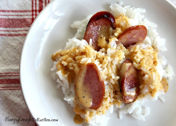 Kielbasa and rice on a plate.