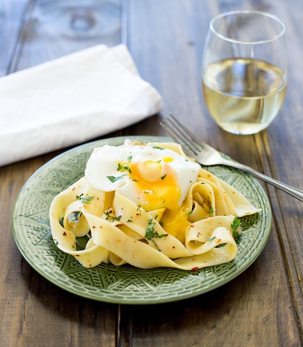Chili pasta on a green plate.