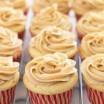 Apple Pie Cupcakes: soft and fluffy vanilla cake wrapped around a miniature apple pie with homemade caramel frosting on top. You're going to love these! From BakingMischief.com