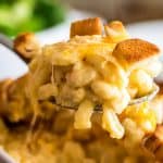 Mac and cheese for two being spooned out of a dish.