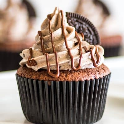Small-batch Oreo Cupcakes, moist chocolate cupcakes with an Oreo baked right into them, and the best Oreo frosting on top! | #cupcakes | #Oreos | Small-batch Desserts |