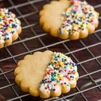 Small-batch shortbread cookies with sprinkles on a baking rack.