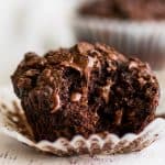 Square photo of Small-batch Chocolate Banana Muffin with a bite out of it.