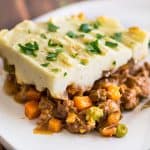 Picture of a slice of Easy Shepherd's Pie With Ground Beef on a white plate.