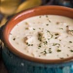 Square photo of Keto Chicken Soup in blue bowl.