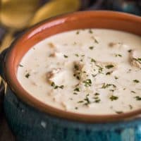 Square photo of Keto Chicken Soup in blue bowl.