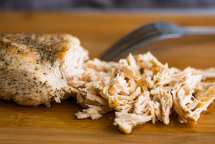 Keto Chicken and "Rice" Soup is rich, creamy, and the BEST keto comfort food. | #keto | #cauliflowerrice | #ketorecipe | Photo of shredded chicken for Keto Chicken Soup.
