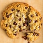 Square photo of One Chocolate Chip Cookie for Two broken into pieces.