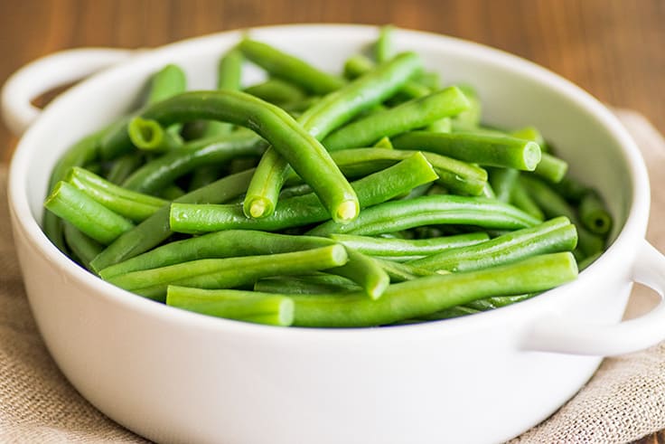 Image of How to Steam Green Beans in the Microwave step 4, cooked green beans in a bowl.
