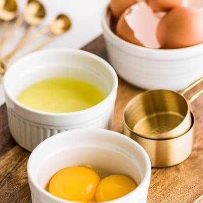 Photo of egg yolks in white ramekin to use in egg yolk recipes.