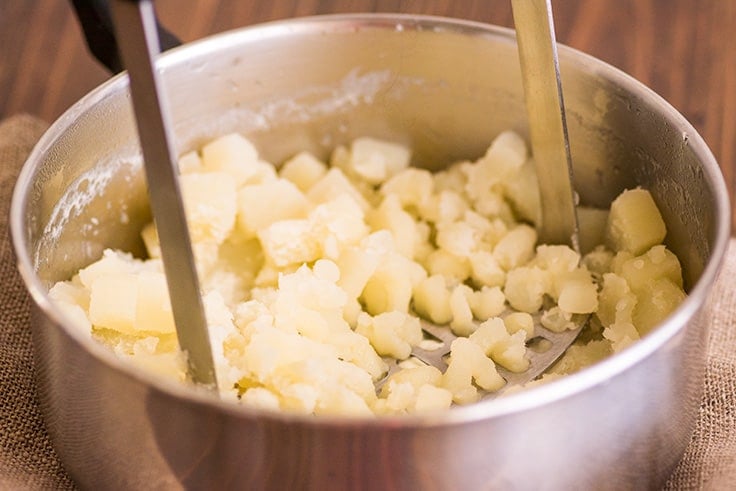 Mashed Potatoes for Two Photo Step 4: potatoes being mashed.