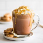 Picture of Peanut Butter Hot Chocolate on a white plate with Nutter Butter Cookies.