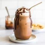 Homemade iced mocha in a mason jar.