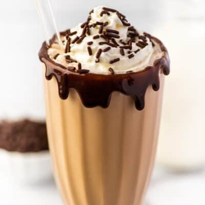 Chocolate milkshake in a tall glass.