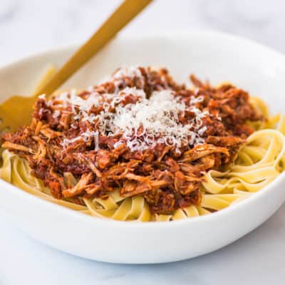 Pork ragu in a white bowl.