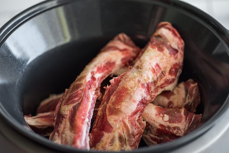 Beef back ribs on a baking sheet.