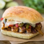 Chicken fajita sandwich on parchment paper.