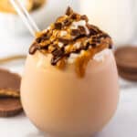 Chocolate peanut butter milkshake in a glass cup.