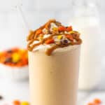Peanut butter milkshake in a glass cup.