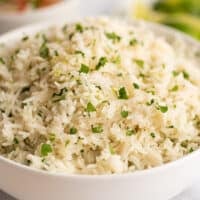 Cilantro rice in a large white bowl.