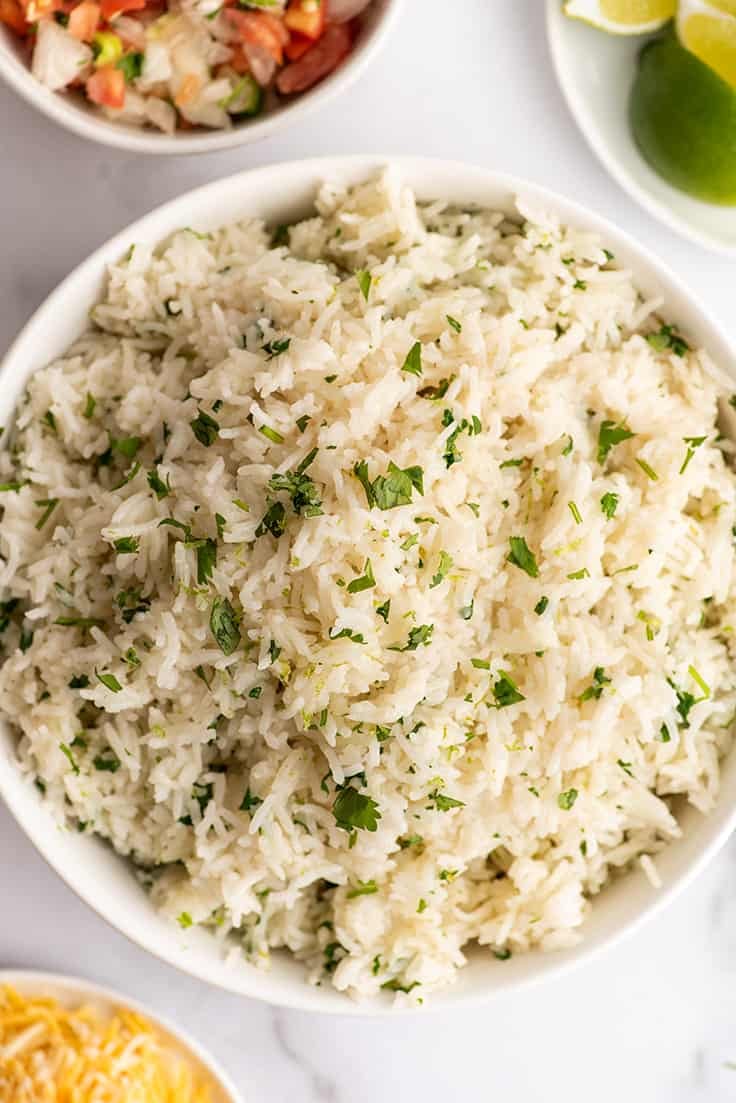 Overhead photo of cilantro lime rice in a white bowl.