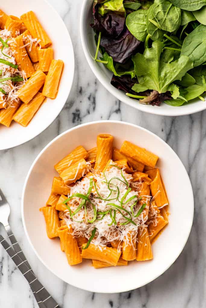 Rigatoni with vodka sauce in a white bowls.