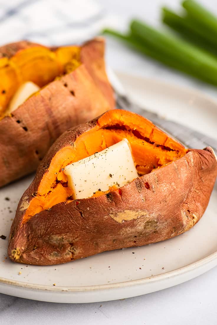 Microwave sweet potato cut open with butter and salt and pepper.
