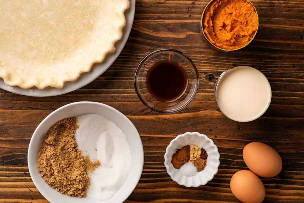 Pumpkin pie ingredients on a table.