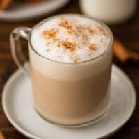 Cinnamon dolce latte in a mug with cinnamon sprinkled on top.
