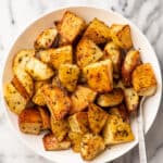 Italian roasted potatoes in a serving bowl.