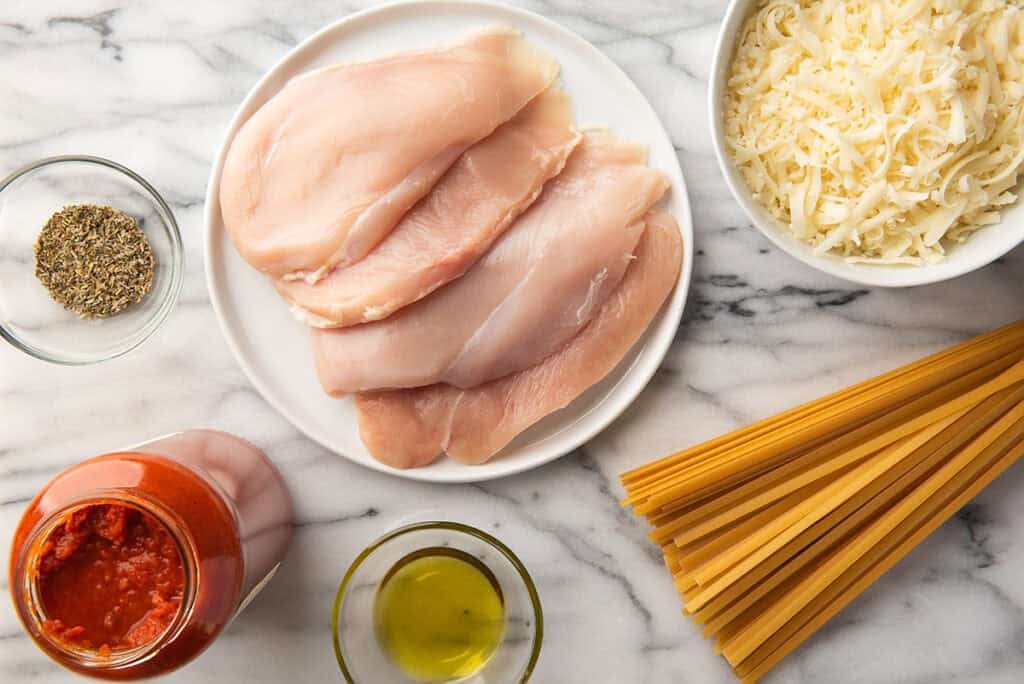 Ingredients for chicken mozzarella on a counter