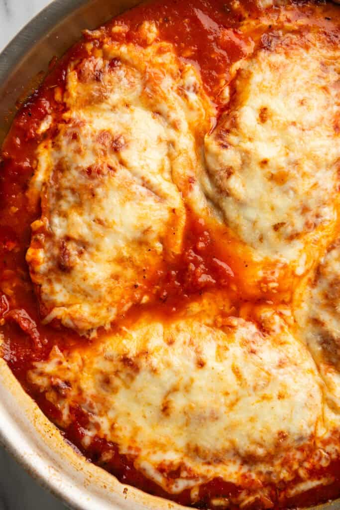 Close photo of mozzarella chicken in a pan