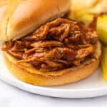BBQ chicken sandwich being assembled.