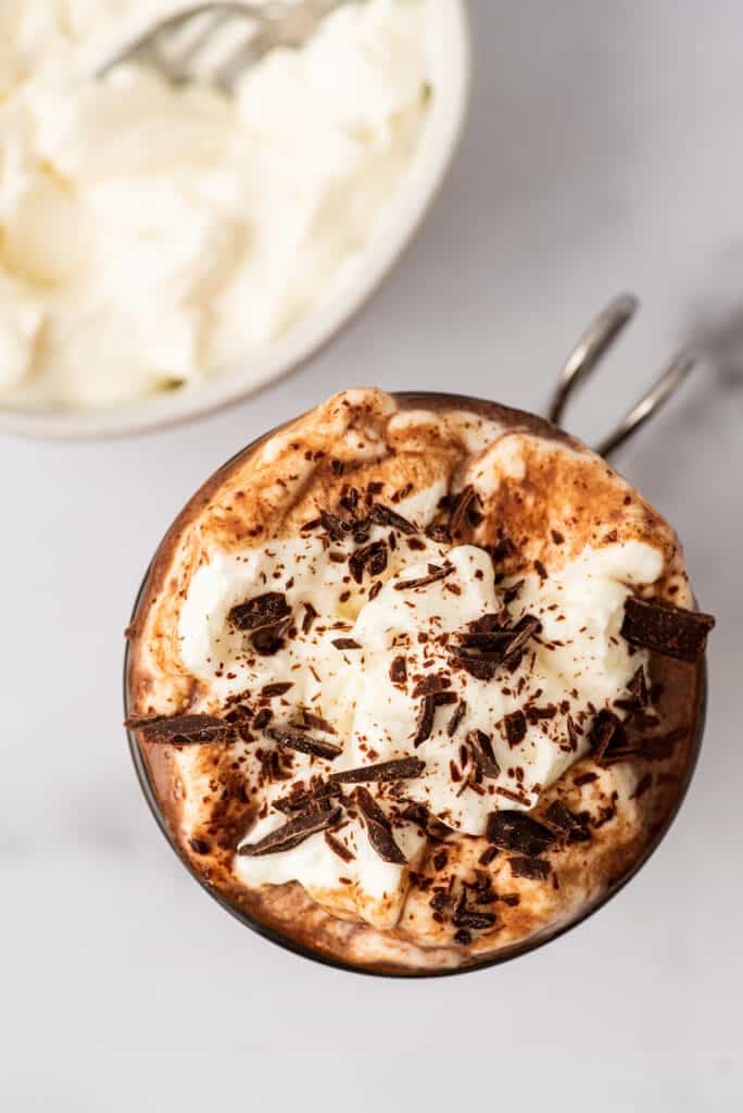 Cream cheese whipped cream over hot chocolate.