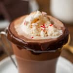 Hot chocolate float in a glass mug.