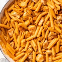 Close up photo of penne alla vodka with chicken.