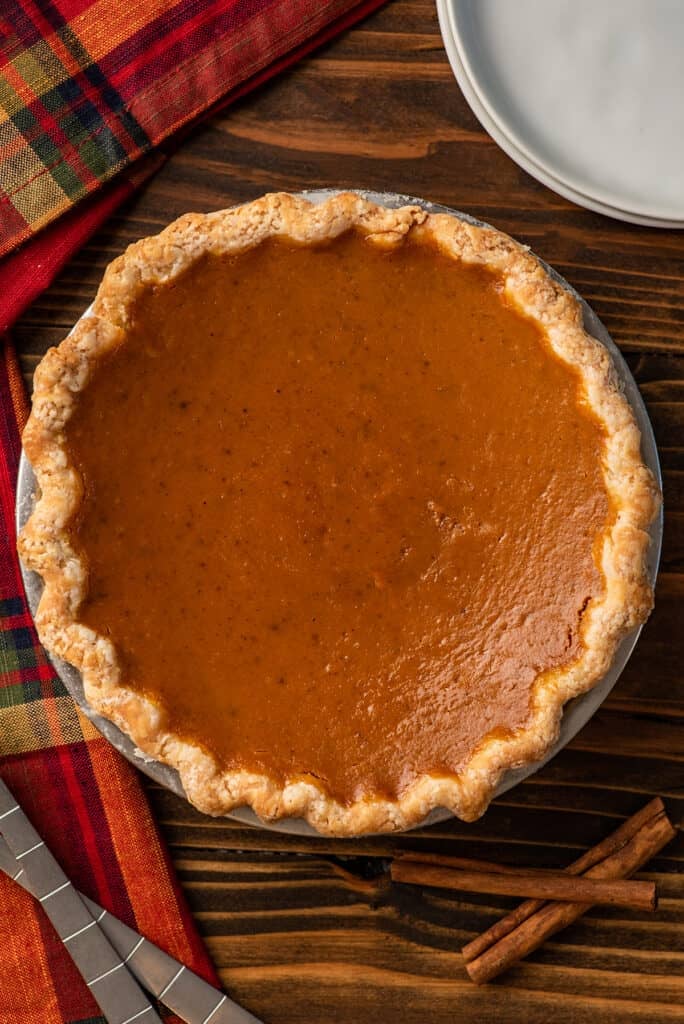 Small pumpkin pie on a table.