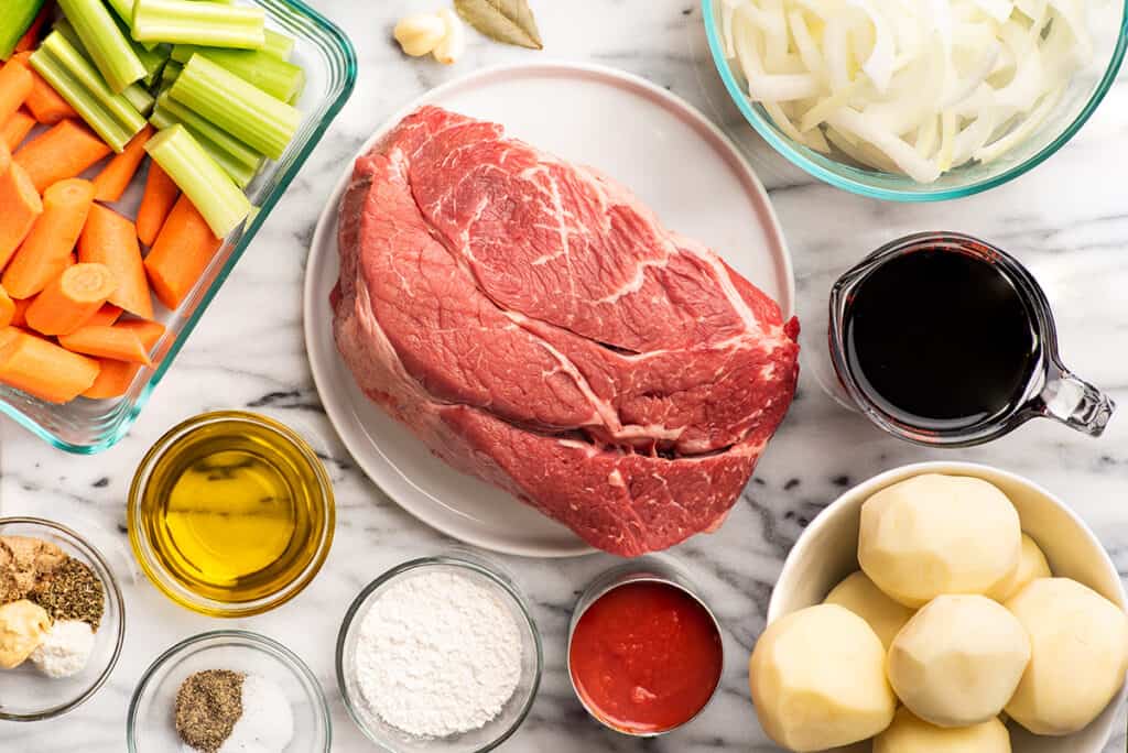 Ingredients for red wine pot roast on a counter.