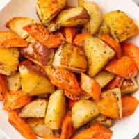 a plate of roasted carrots and potatoes