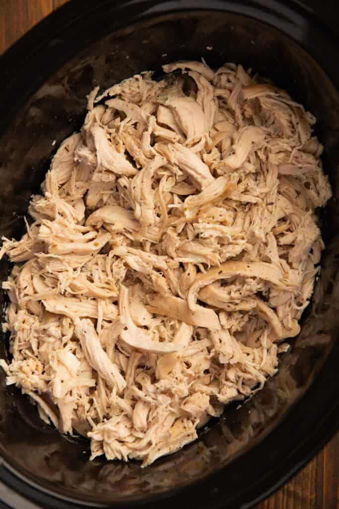 Close up of slow cooker shredded chicken.