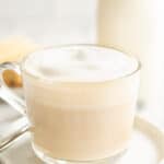 a coffee cup of london fog latte on a plate