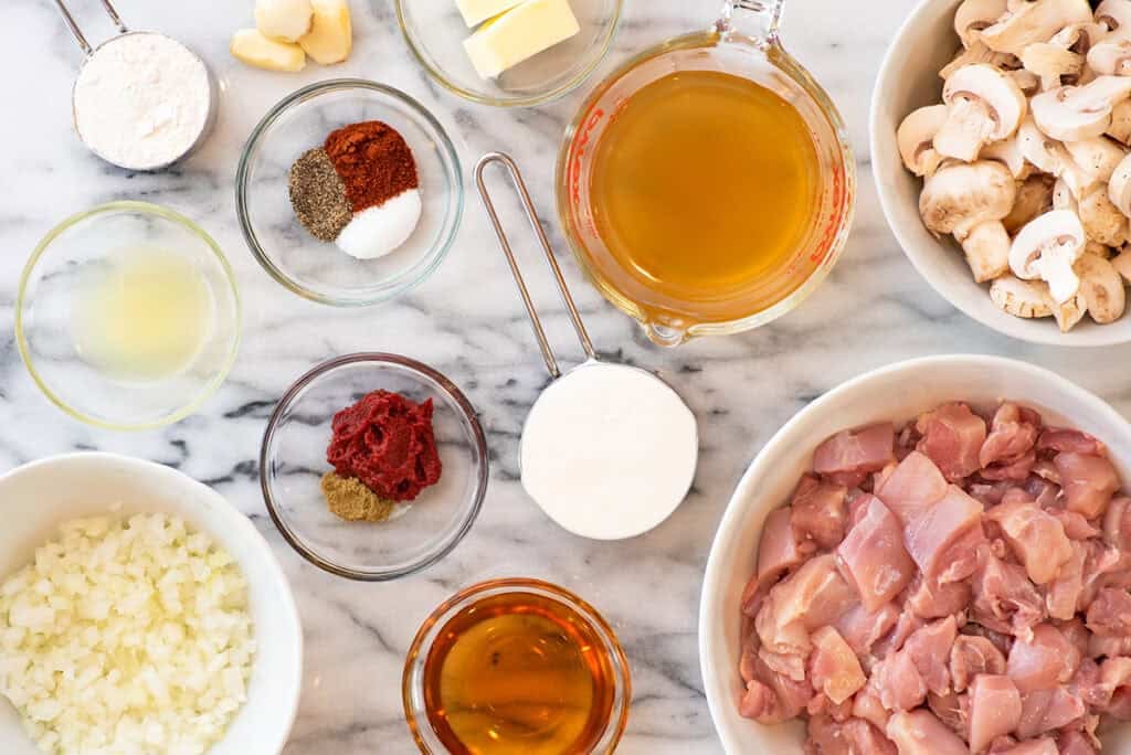 Chicken stroganoff ingredients measured out on a counter