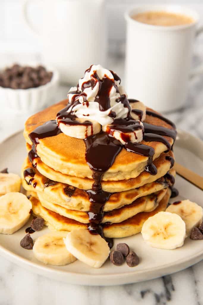 Buttermilk pancakes with chocolate chips on a plate.