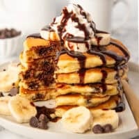 Chocolate chip pancakes with whipped cream and chocolate sauce