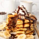 Chocolate chip pancakes with whipped cream and chocolate sauce